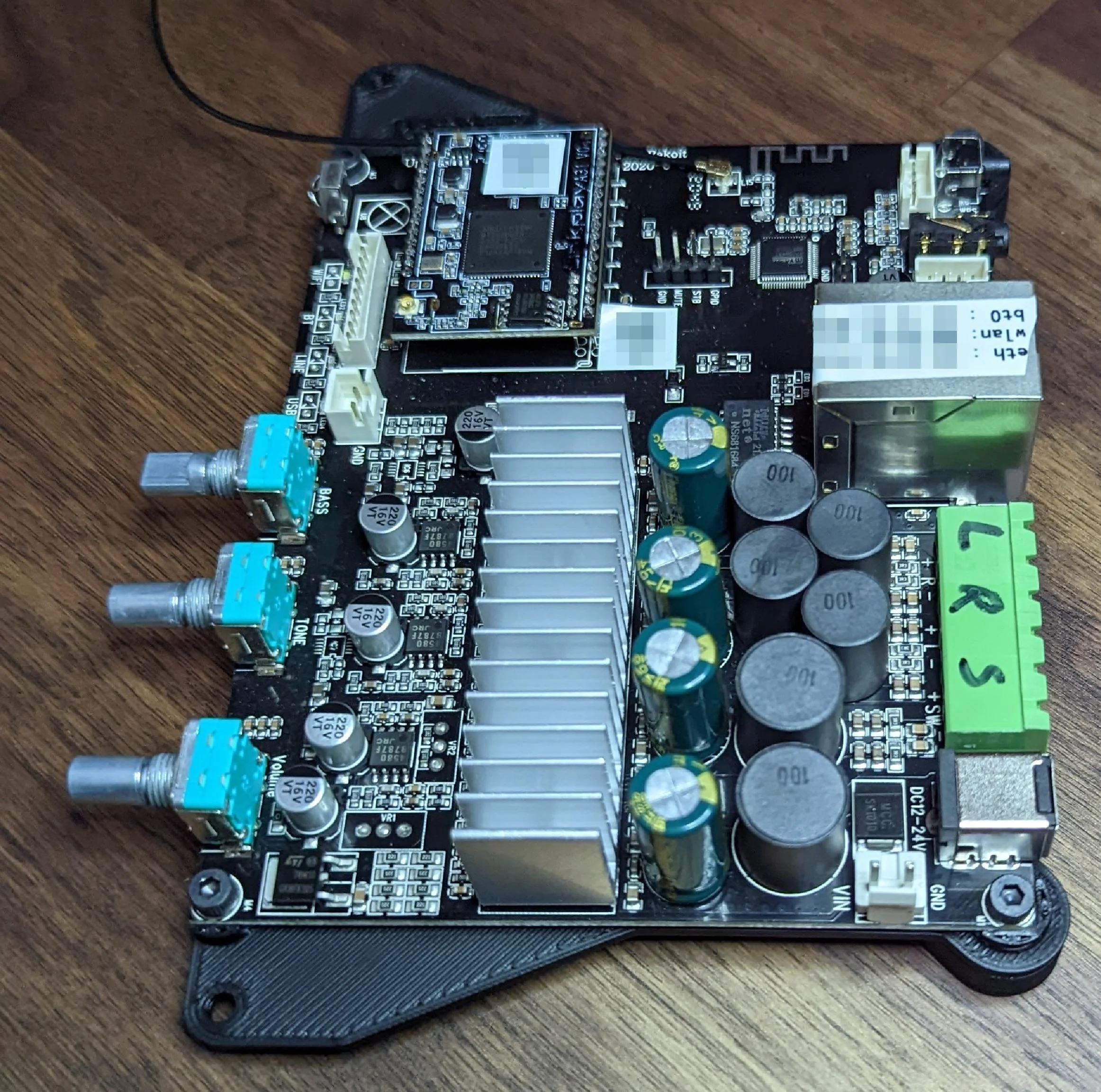 Pro tip: print the MAC addresses of a network device somewhere on the device... Also, don't put unique device IDs onto the internet!