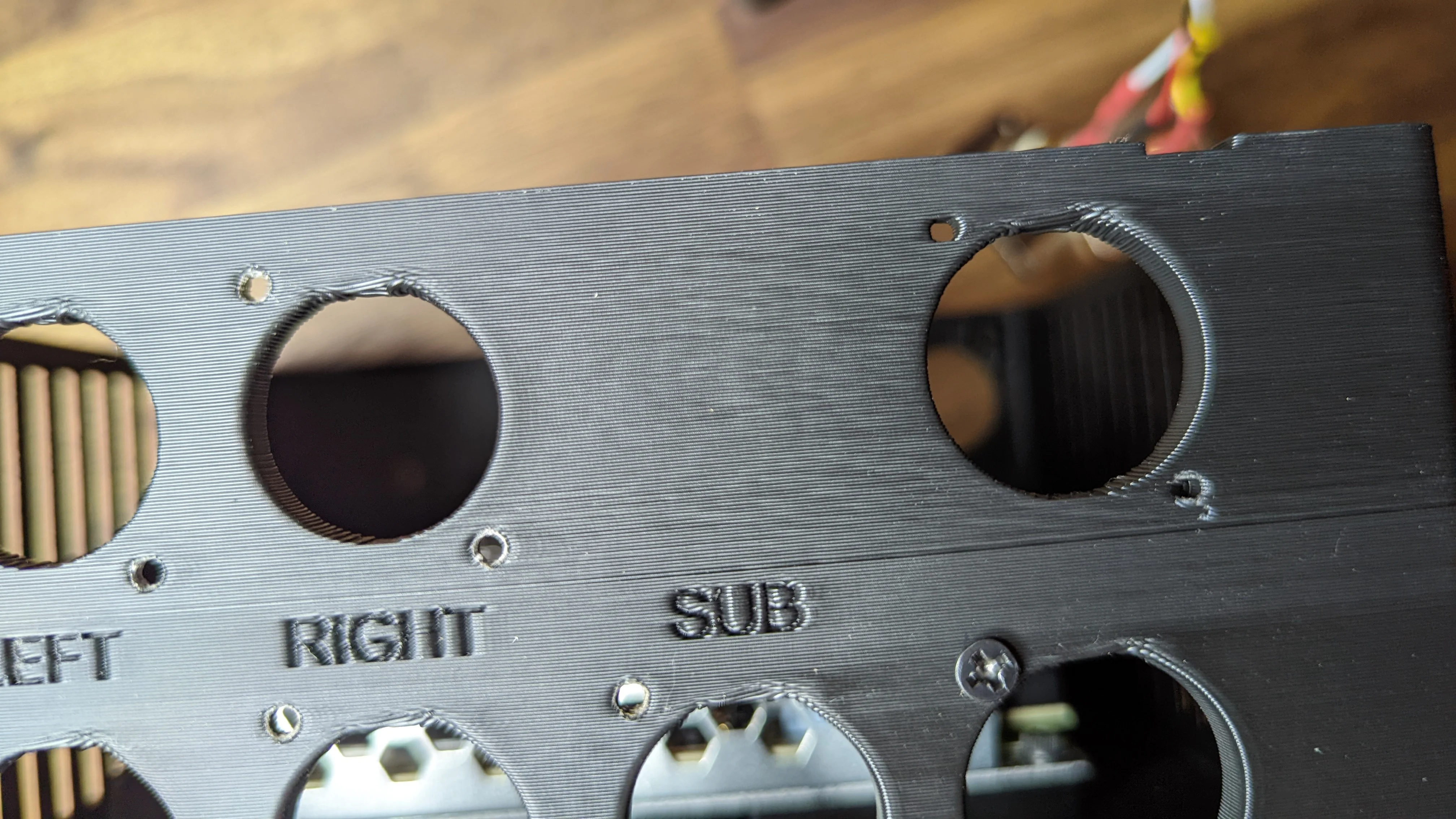 Notice the holes on the left that have been "rightsized" during threading and the holes on the top right that are relatively deformed still.