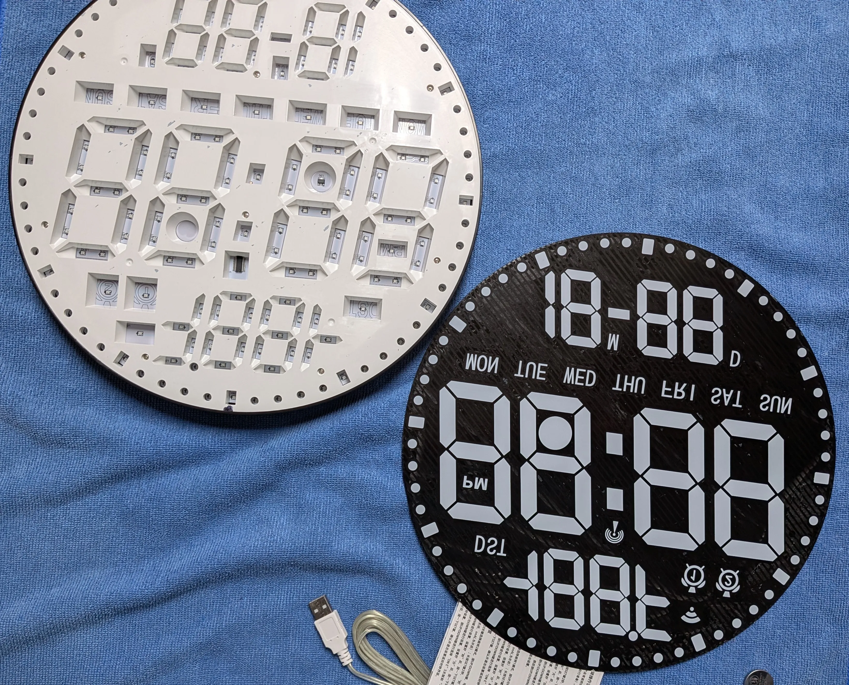 Lots of SMD neopixels and a partition/mask system to keep high contrast between the segments.