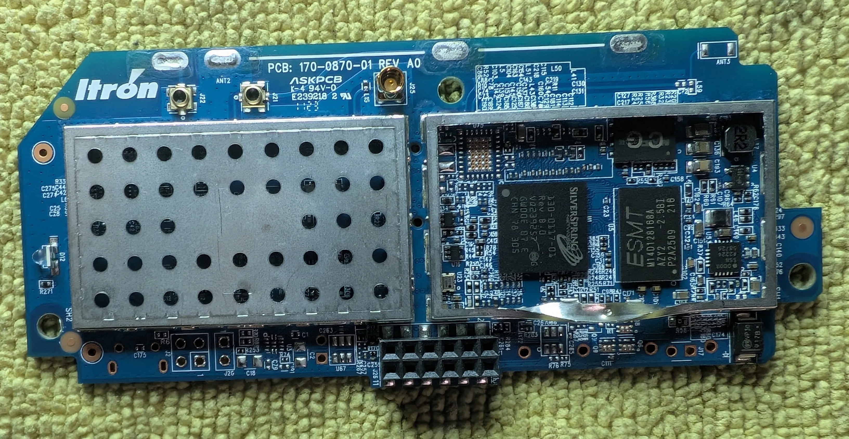The 2x8 pin header (center, bottom) mates to the main PCB.