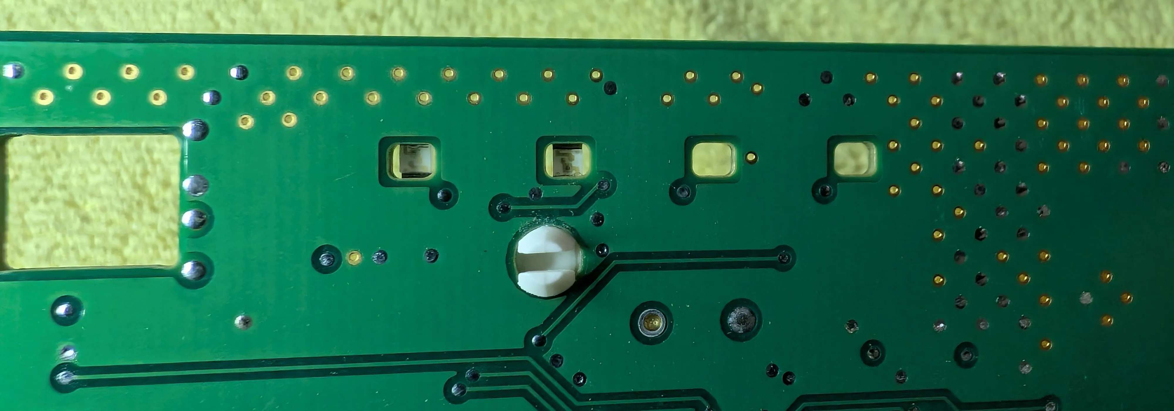 LEDs face 'down' to shine through the cutouts in the PCB and the lid.