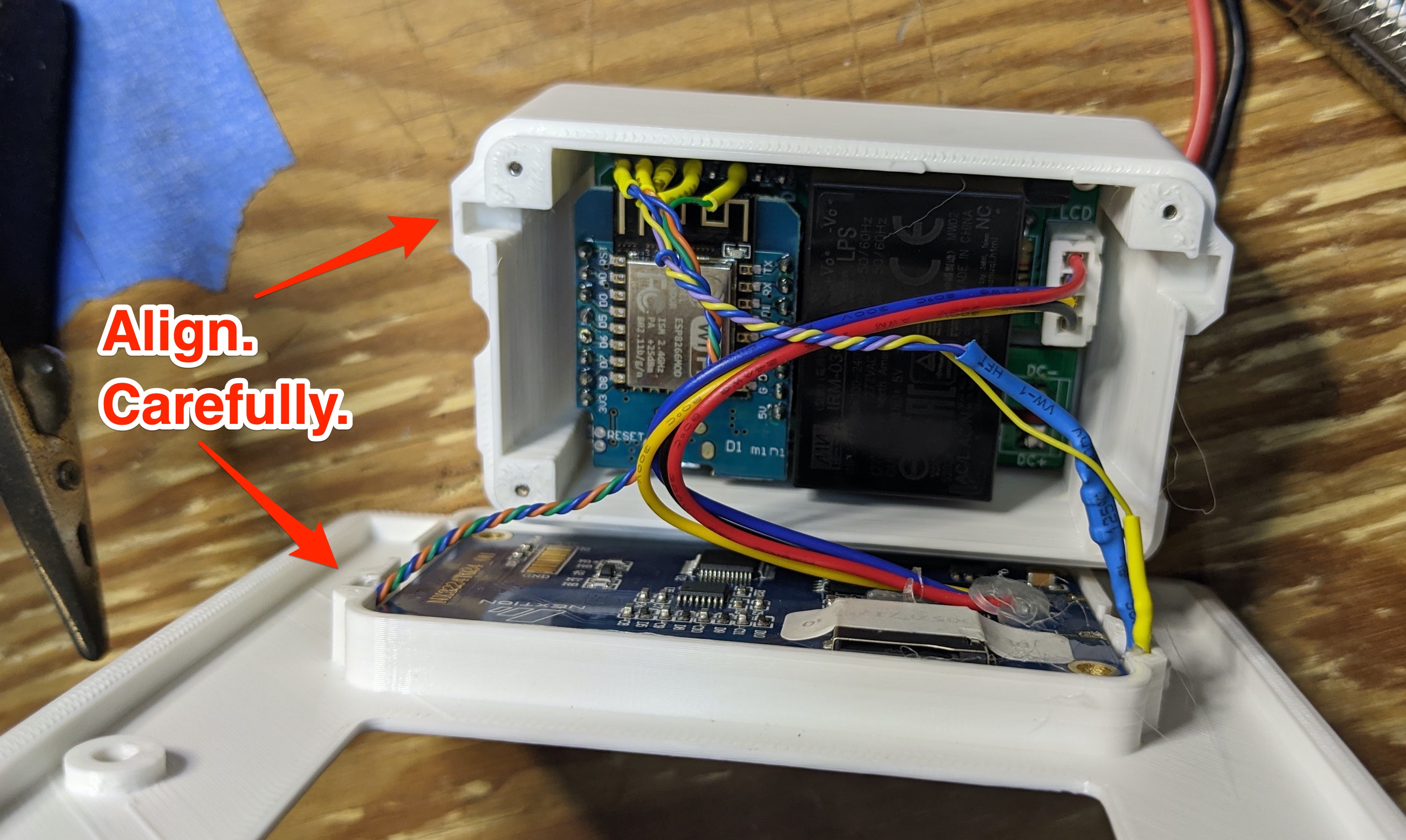 picture of finished assembly ready to be screwed together. Annotated to call attention to pinch points w/ wires