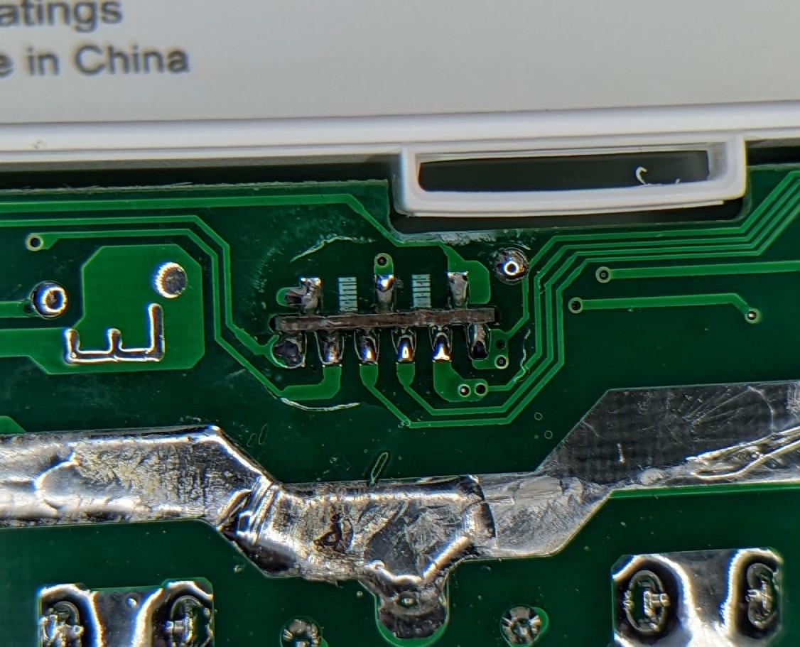You know what's cheaper than pin headers? PCB fingers in slots.