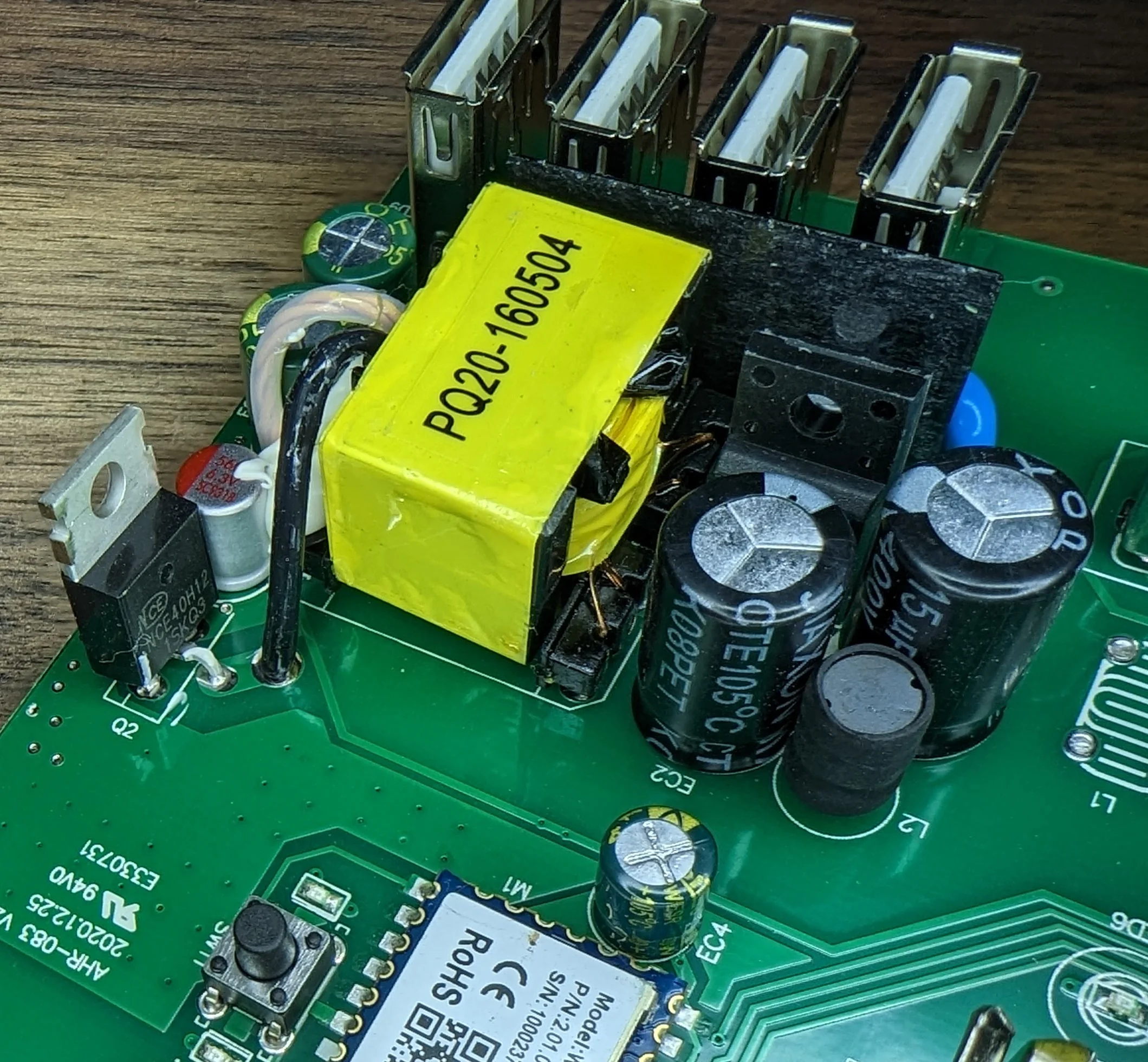 Note the black insulating material separating the USB ports from the mains side of things.