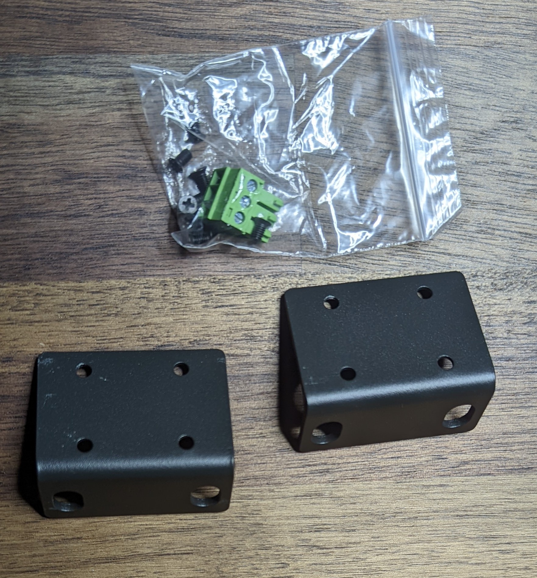 Rack Mount ears, two extra screws and the proper connector block needed to interface with the UART.