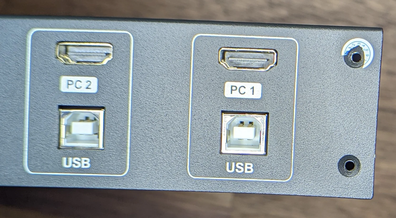 Don't forget the screw behind the sticker