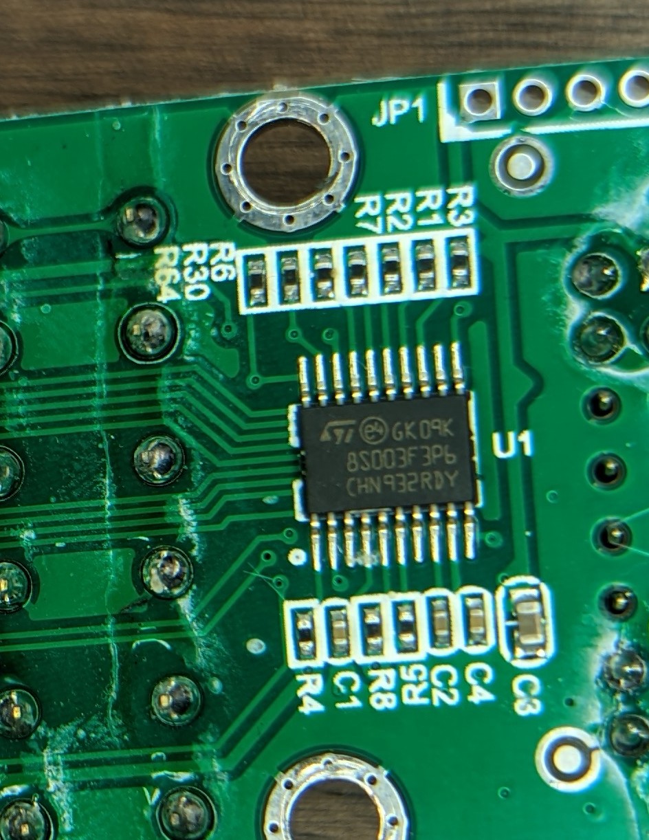 Notice how at least 4 of the pins from the ribbon cable connector are note soldered to the PCB...