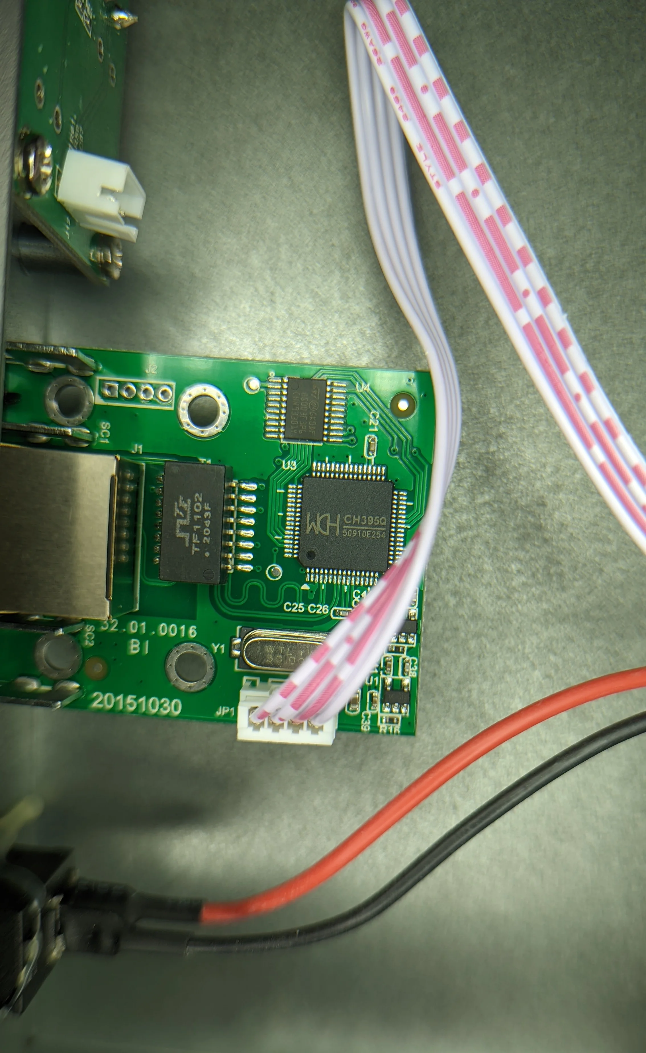 The small LAN pcb is attached directly to the front panel with screws mating with some 90 degree flanges soldered to the PCB