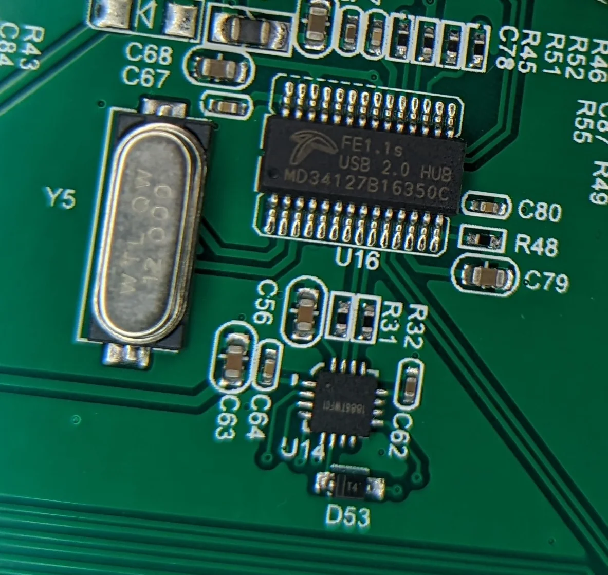 I can't make out the markings, but the 16 pin square IC is almost certainly an audio ID for the unpopulated headphone jack.