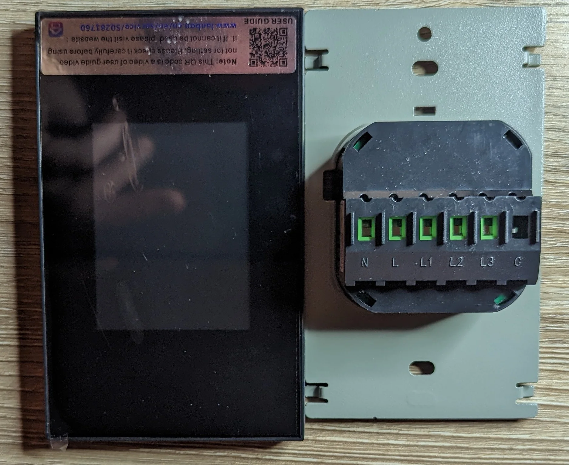 Picture showing the front of the switch next to the portion of the switch that is mean to be installed in the wall