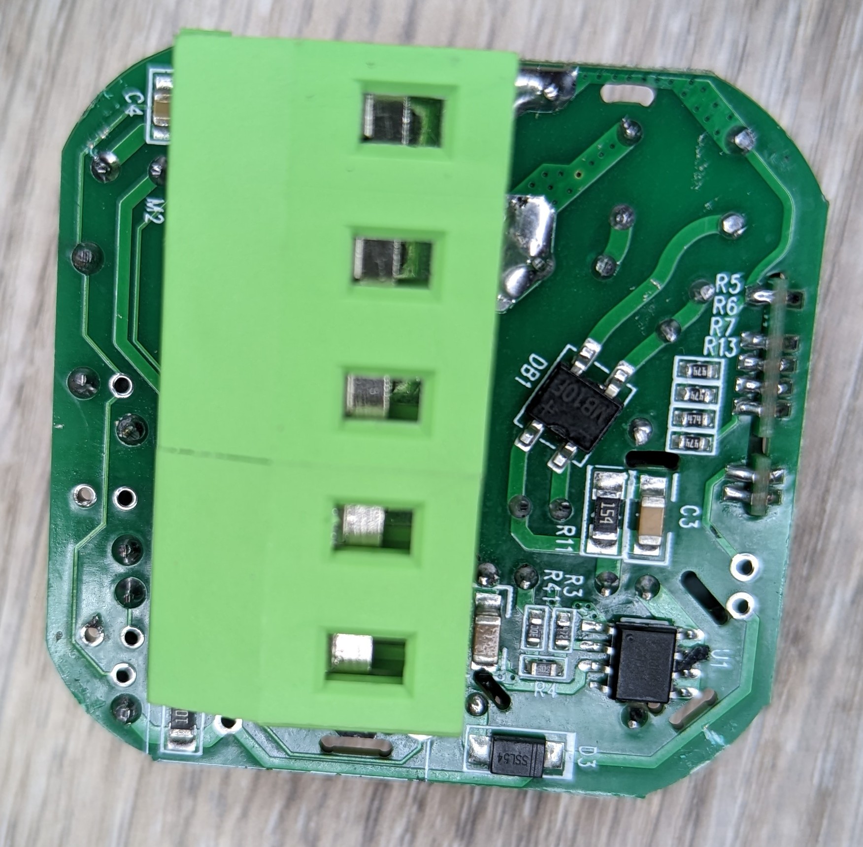Another picture of the power module PCB from the rear. A single unlabeled IC and several passive components are present