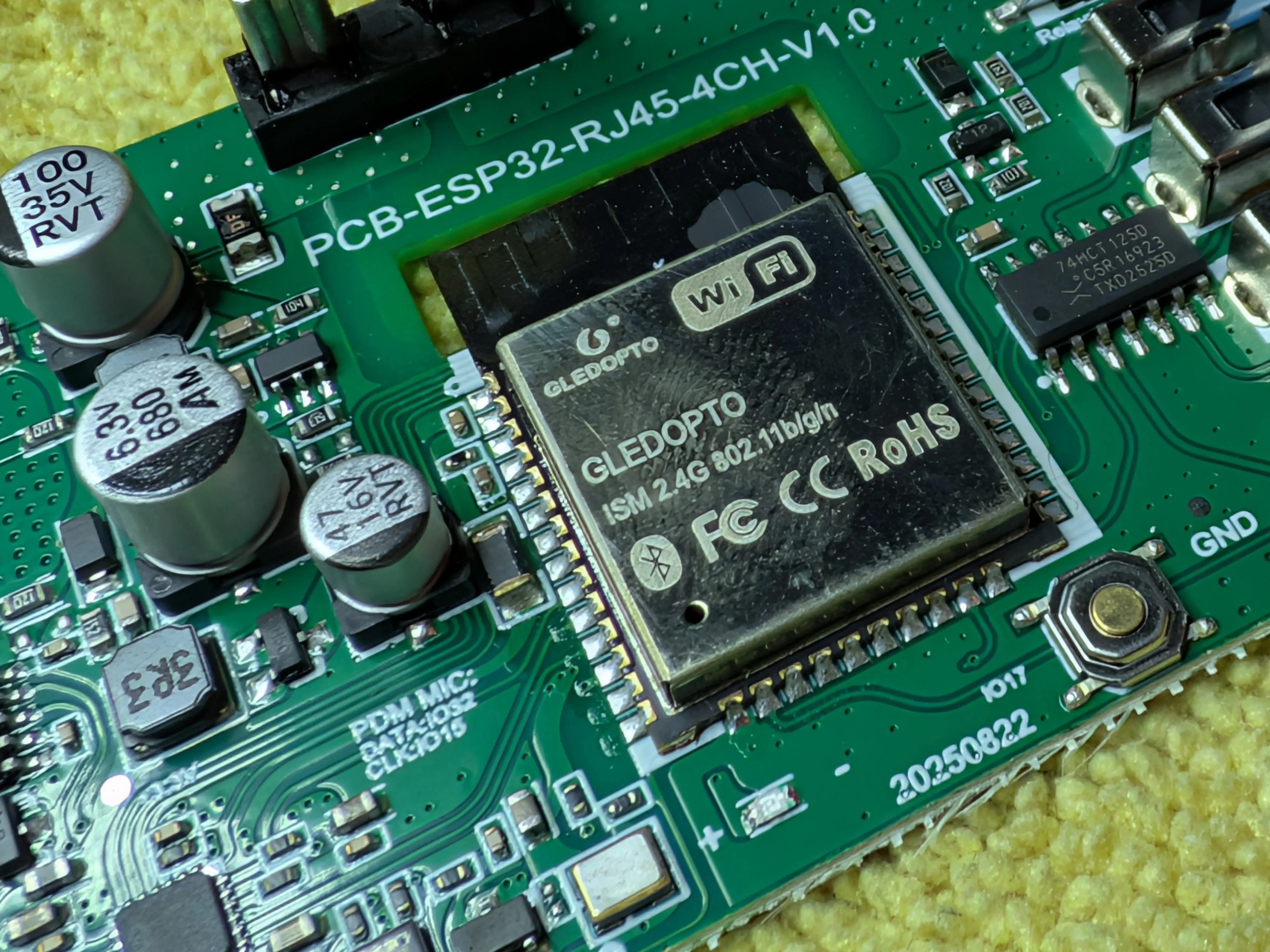 Apparently if you order enough of them, Espressif will put your logo on the module.