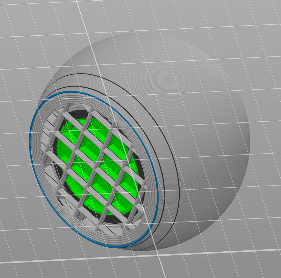 This is the 'per-layer' view from the slicer with a 'bottom-up' perspective. As before, Grey is TPU, Green is ABS, and the thin blue circle represents the topmost layer of the support material.