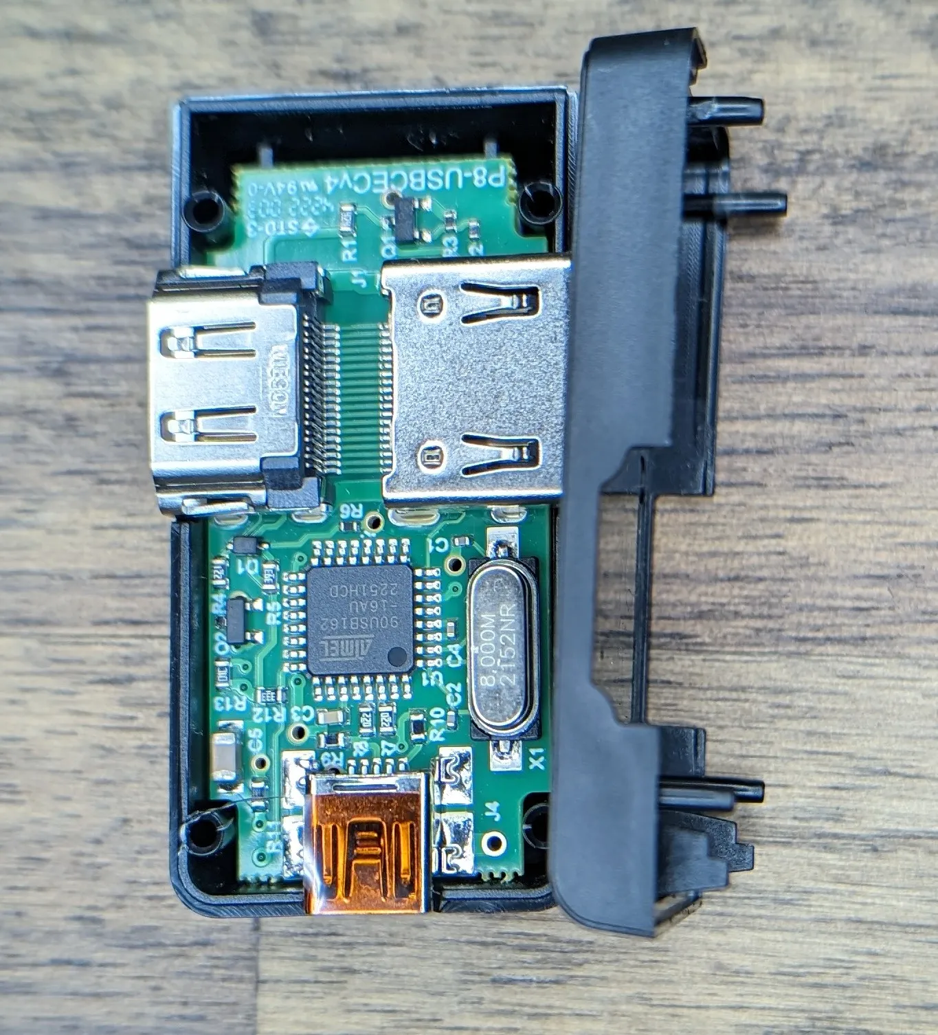 Opening is trivial. No glue or anything. Just a few pins and sockets. Gently pry the two halves apart and you're in.