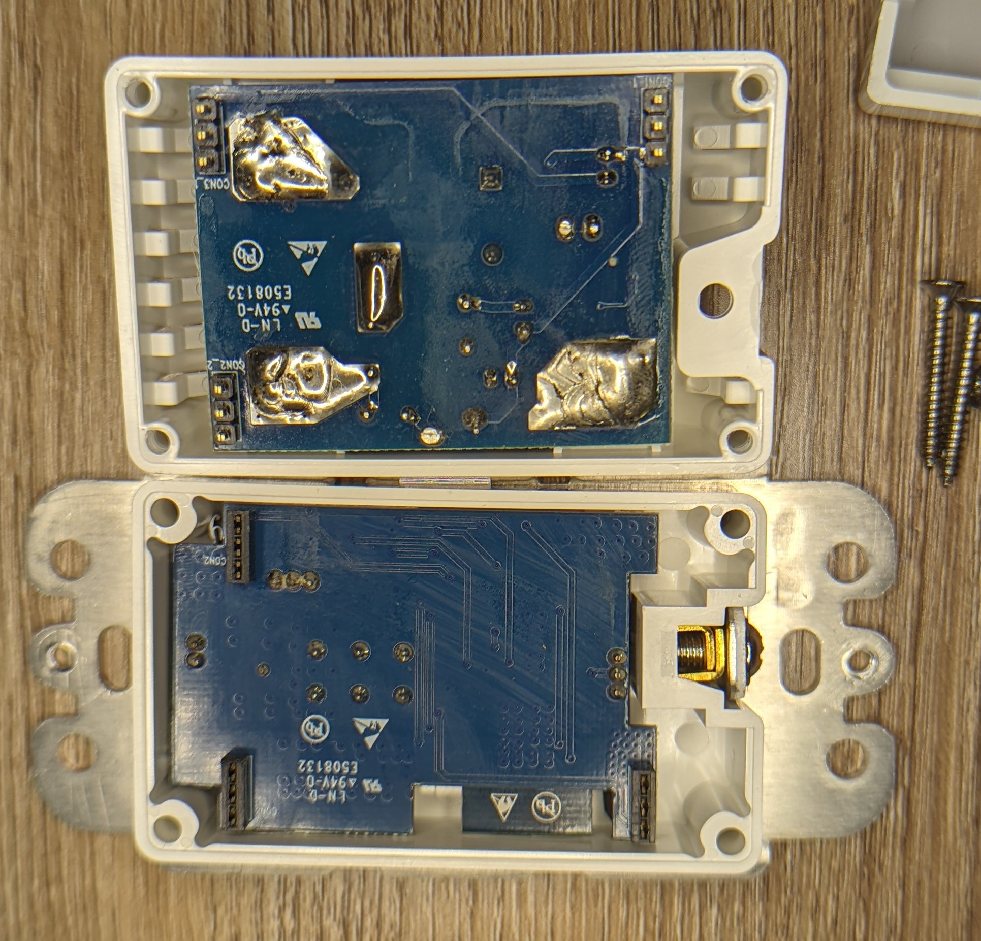 Picture of ths switch body halves with the internal PCBs facing out.