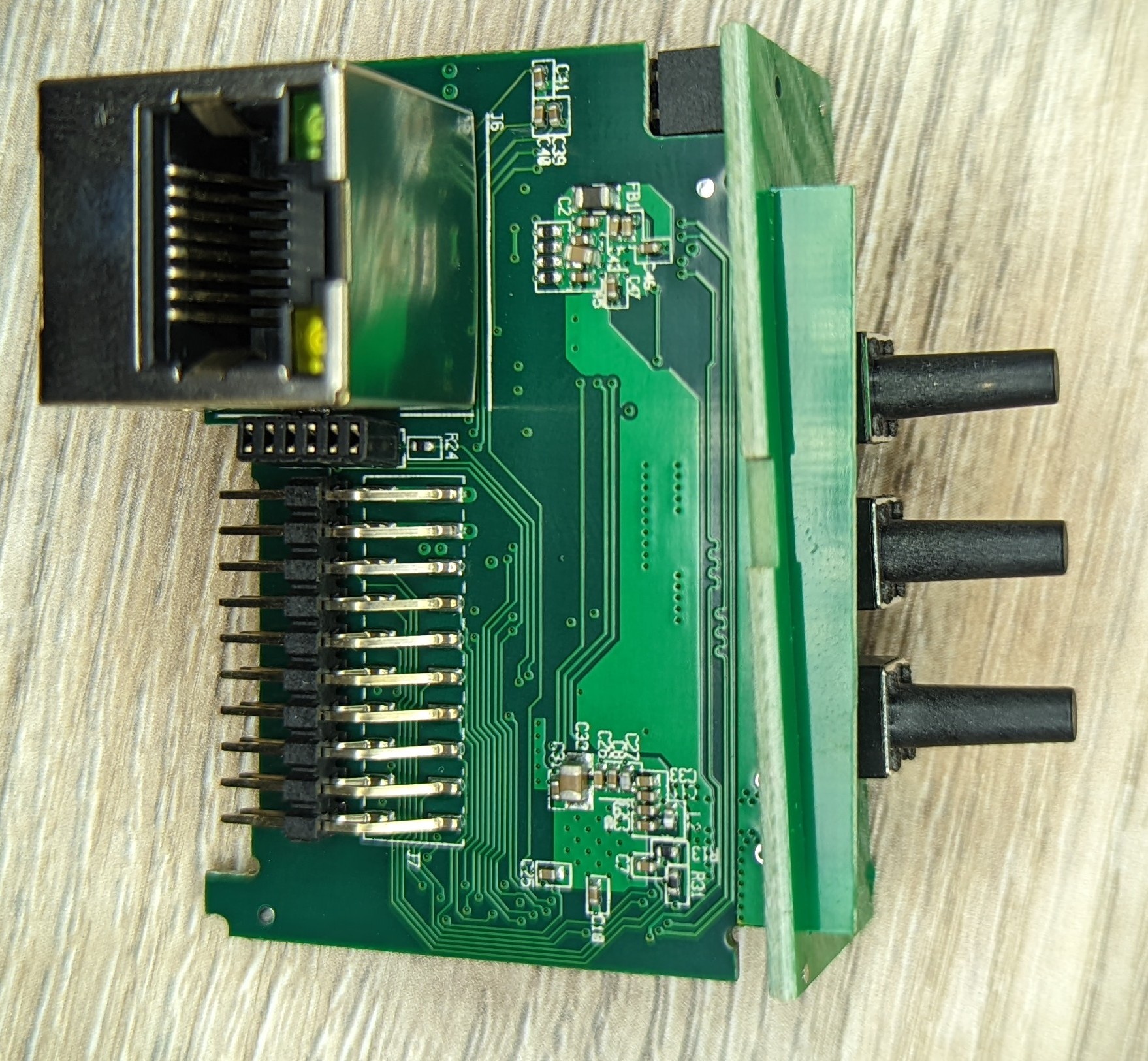 Picture showing primary MCU daughterboard from the side with the ethernet jack attached.