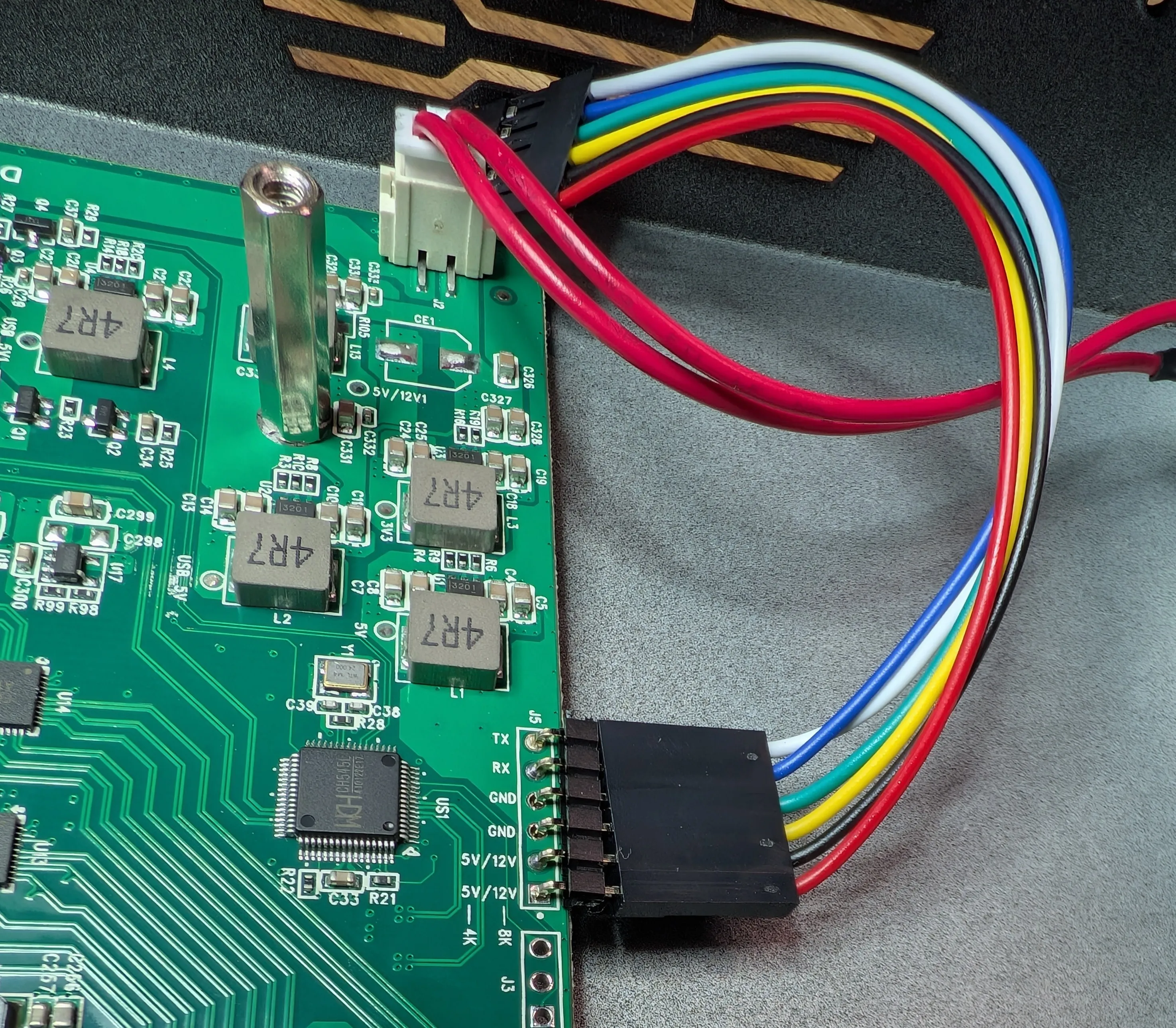 Angled shot of the dupont connector between the top (HDMI) and bottom (USB) PCBs.