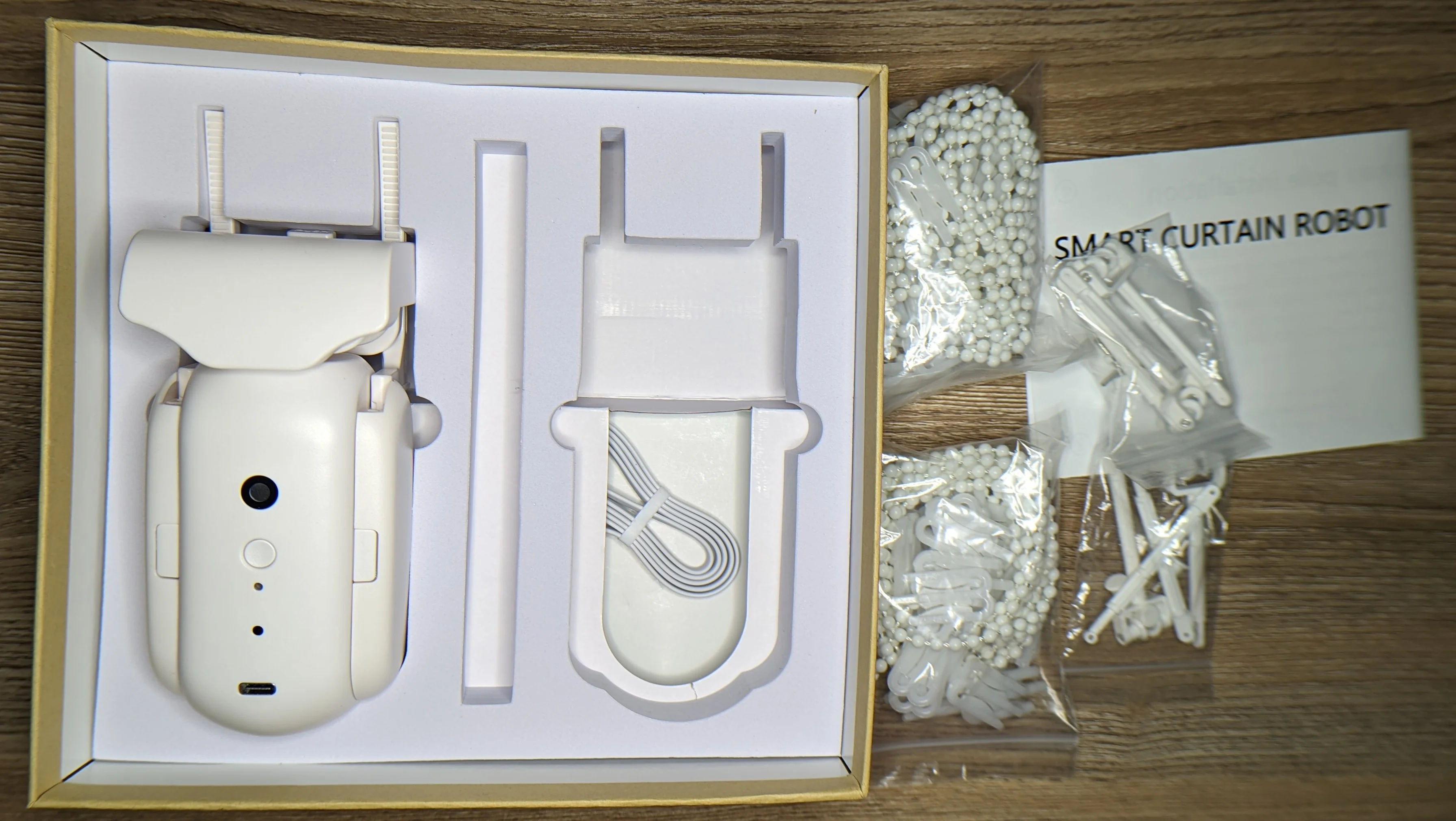 Slightly warped photo showing the content of hte box after some initial unpacking