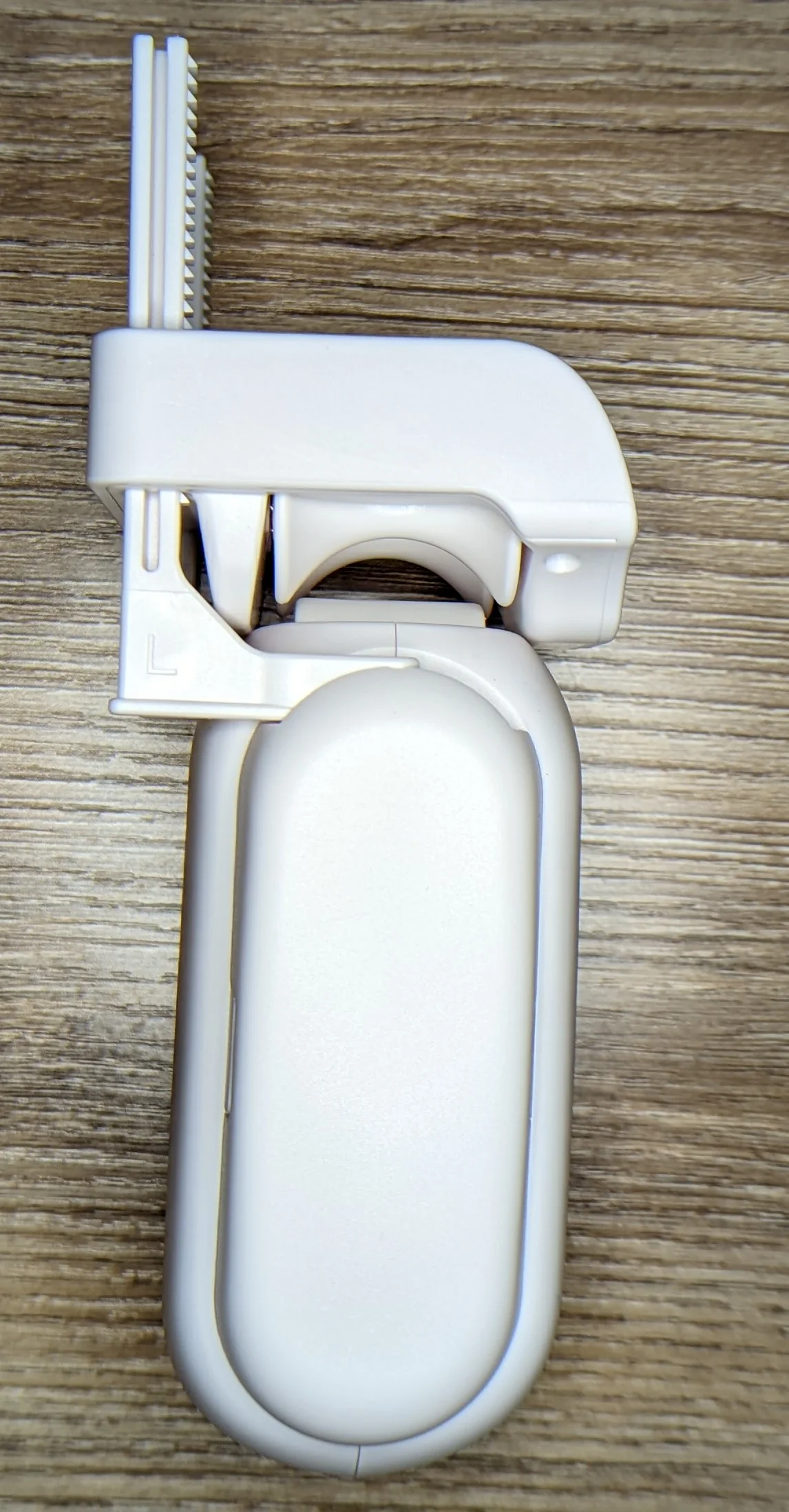 Closeup photo of the side of the curtain robot with all hardware attached showing the primary drive mechanism.