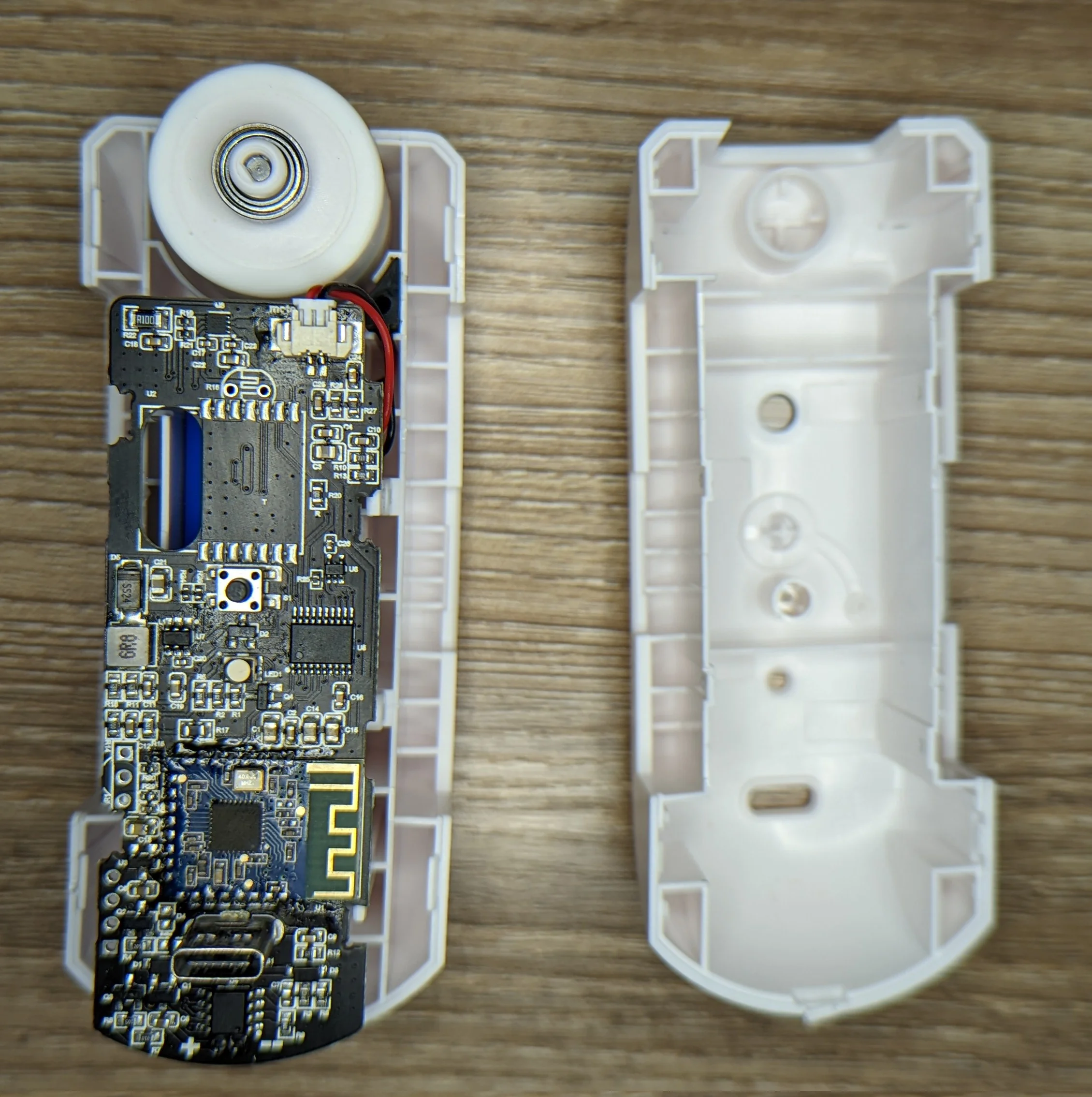 Photo showing the internals of a robot. A fairly sophisticated PCB is visible.