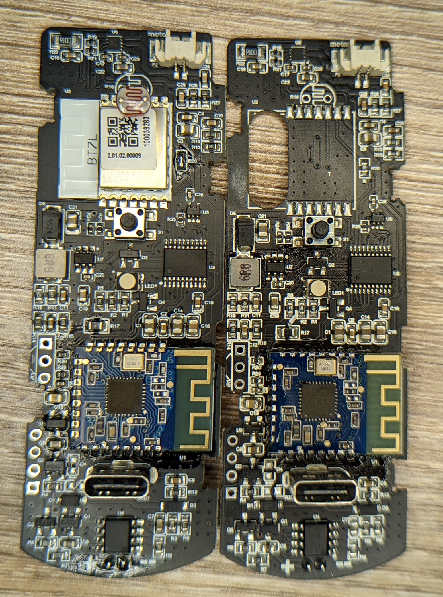 Photo showing closeup of the top of the main PCBs from both units side by side. It's clear that one PCB has two radio modules equipped.