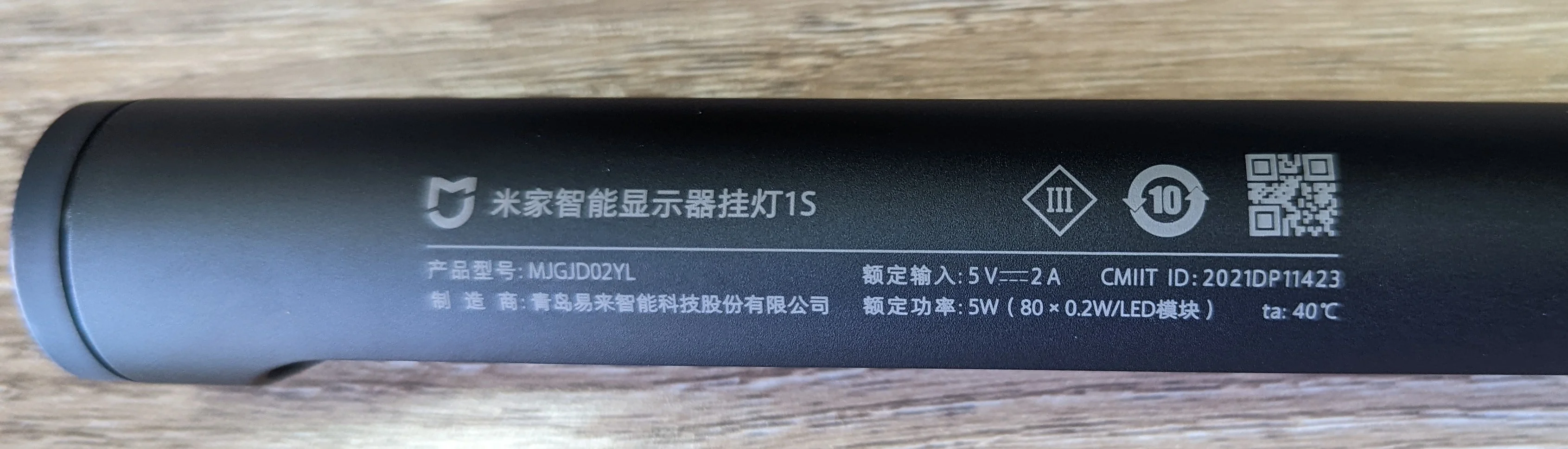 Photo showing the various product info and regulatory markings on the lamp