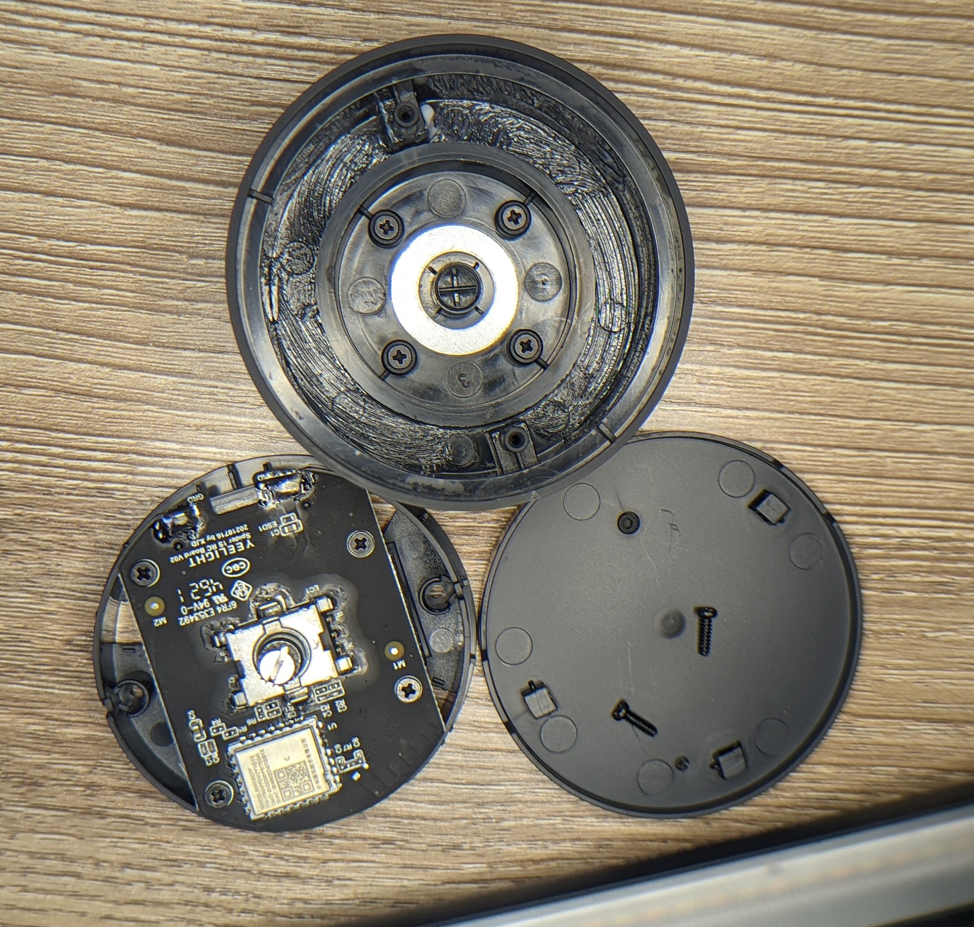 Photo of the remote broken down into it's primary components; the PCB is visible.