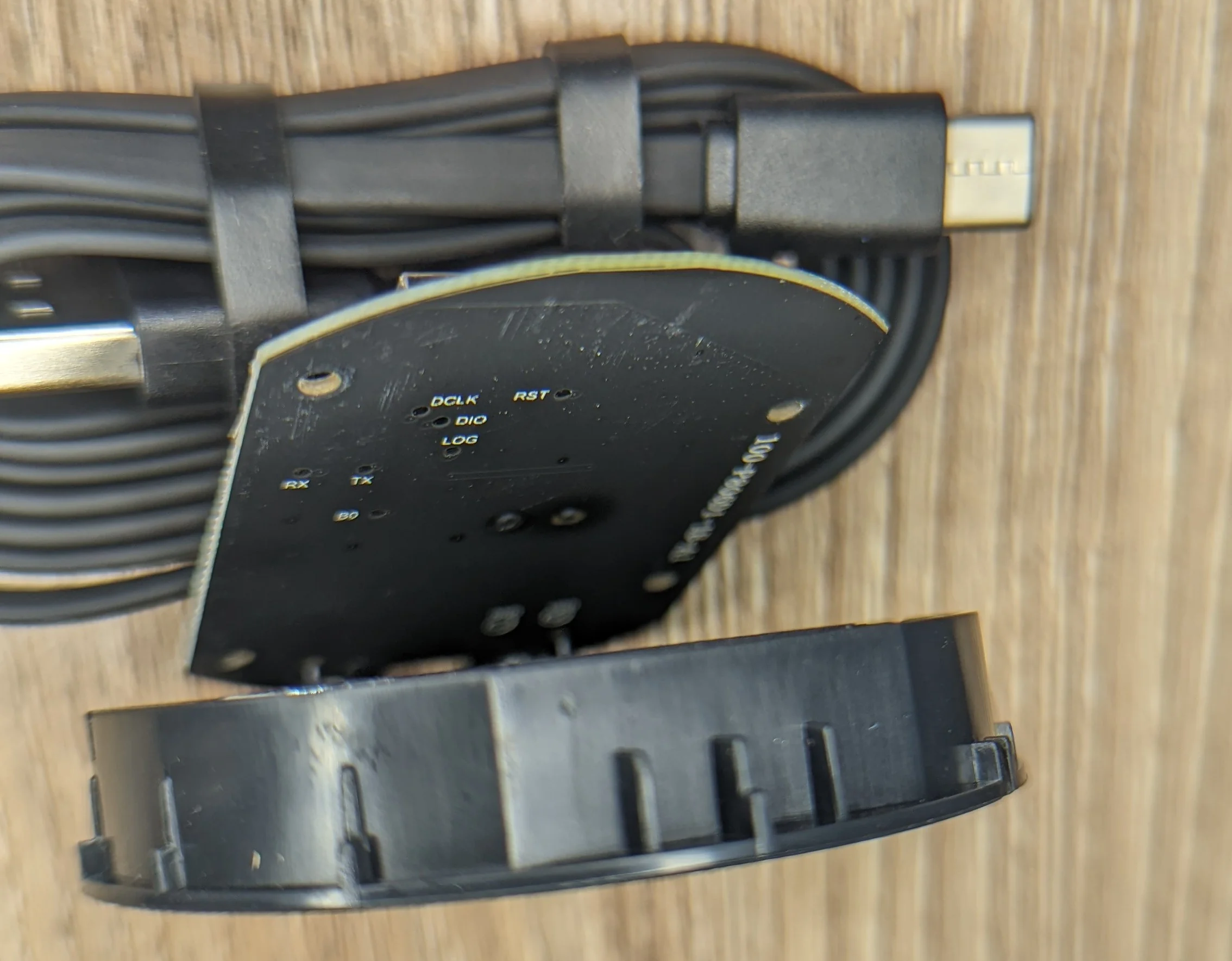 Photo of the remote puck PCB underside showing some of the test points and other PCB markings.