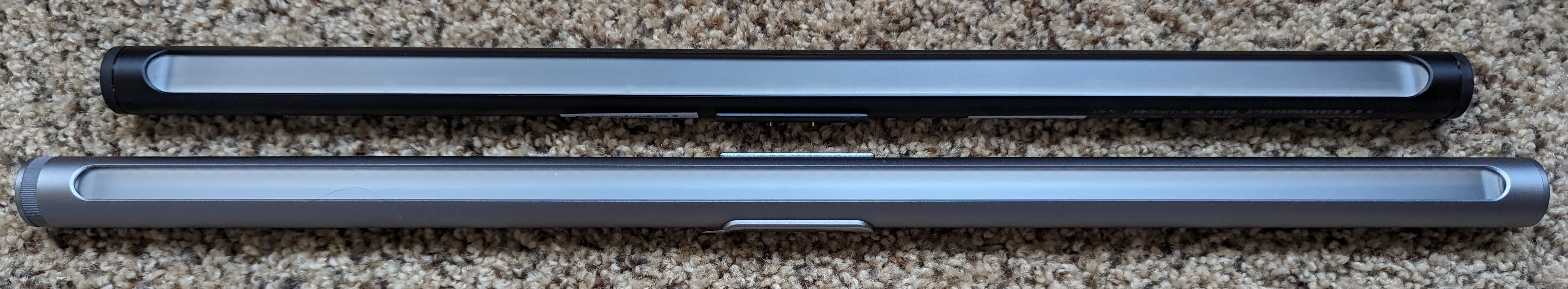 Picture showing the Yee light bar next to the Xaomi light bar. The Yeelight is slightly longer and has a larger end cap on the left.